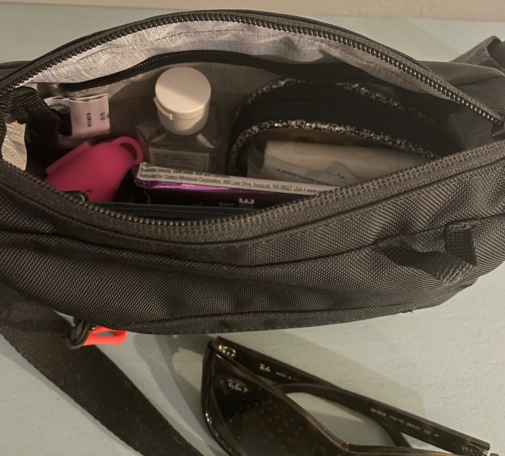 The best travel purse contents visible from the top of an open purse